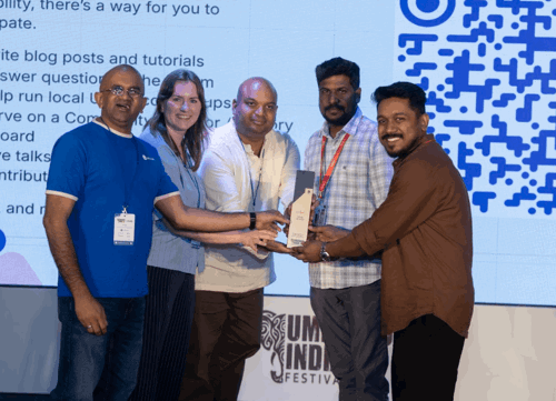 Sponsor appreciation slide/moment on stage, Giriraj Digital branding visible