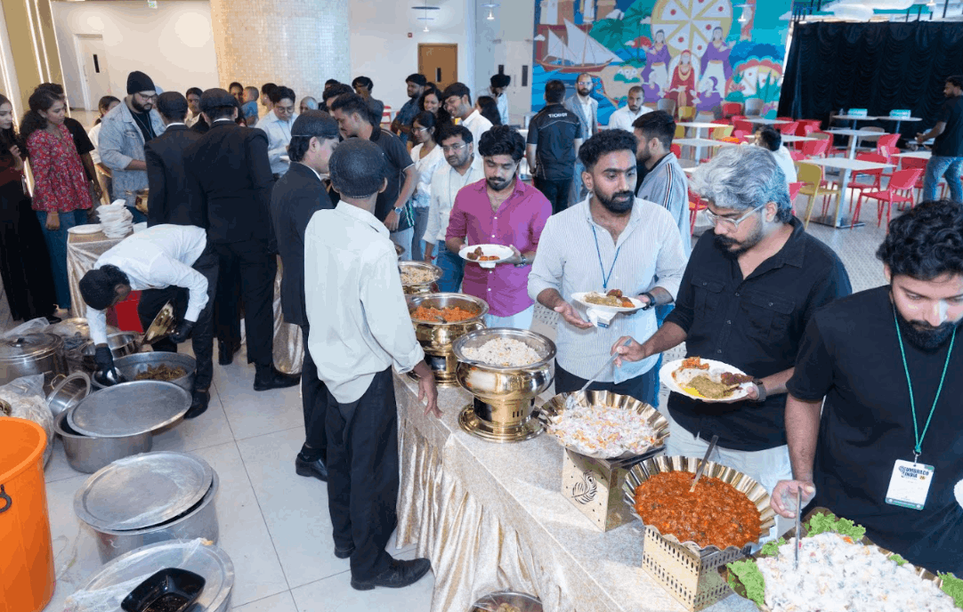 Lunch spread — paneer butter masala, halwa, buffet setup