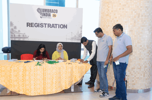 Registration desk — Anjumol and Summya handing out badges
