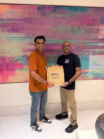 Presenting traditional Gujarati gifts to the Umbraco HQ team — close-up moment