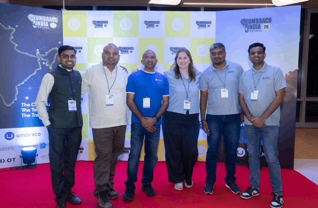 Closing group photo — full delegation, festival banner in the background