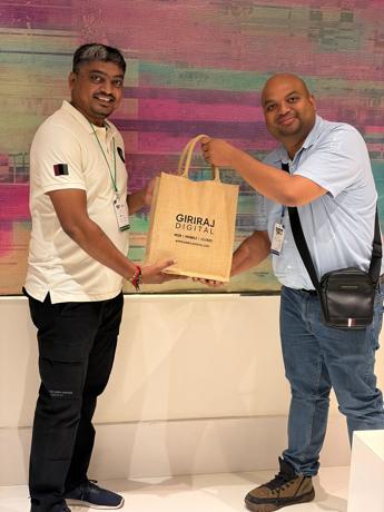 Presenting traditional Gujarati gifts to the Umbraco HQ team — close-up moment