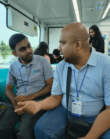 Hackathon in full swing — developers at laptops, whiteboards, collaborative energy
