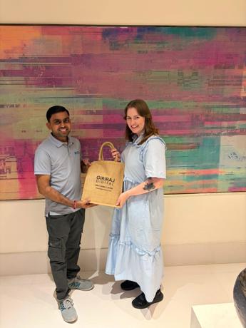 Presenting traditional Gujarati gifts to the Umbraco HQ team — close-up moment