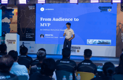 Vishal Tim on stage sharing his story — emotive, candid shot