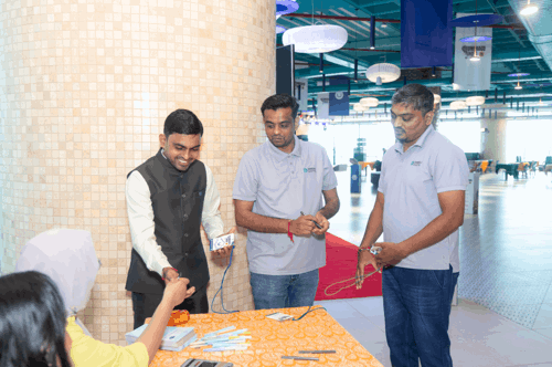 Registration desk — Anjumol and Summya handing out badges